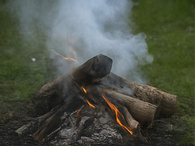 Smoky green wood campfire